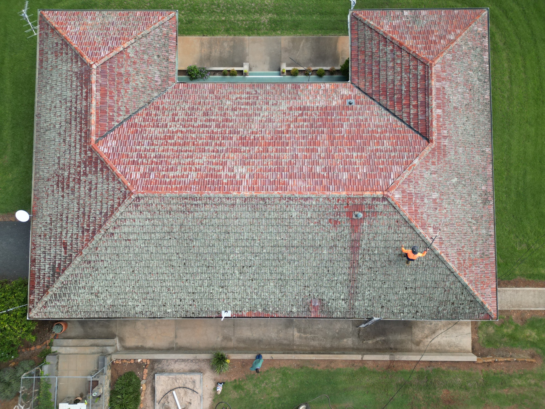 Aerial view of a Gunnedah terracotta roof heavily stained with moss and lichen before restoration