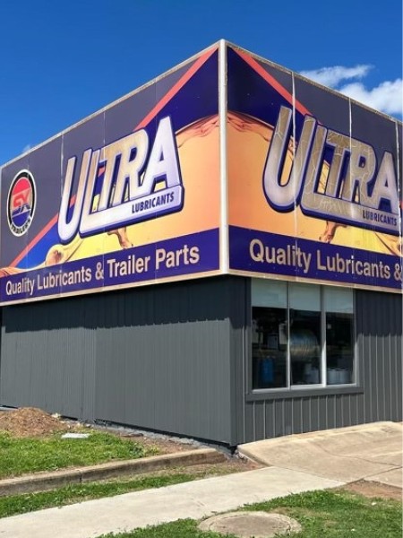 The same Tamworth shop front after a charcoal two-coat airless spray finish