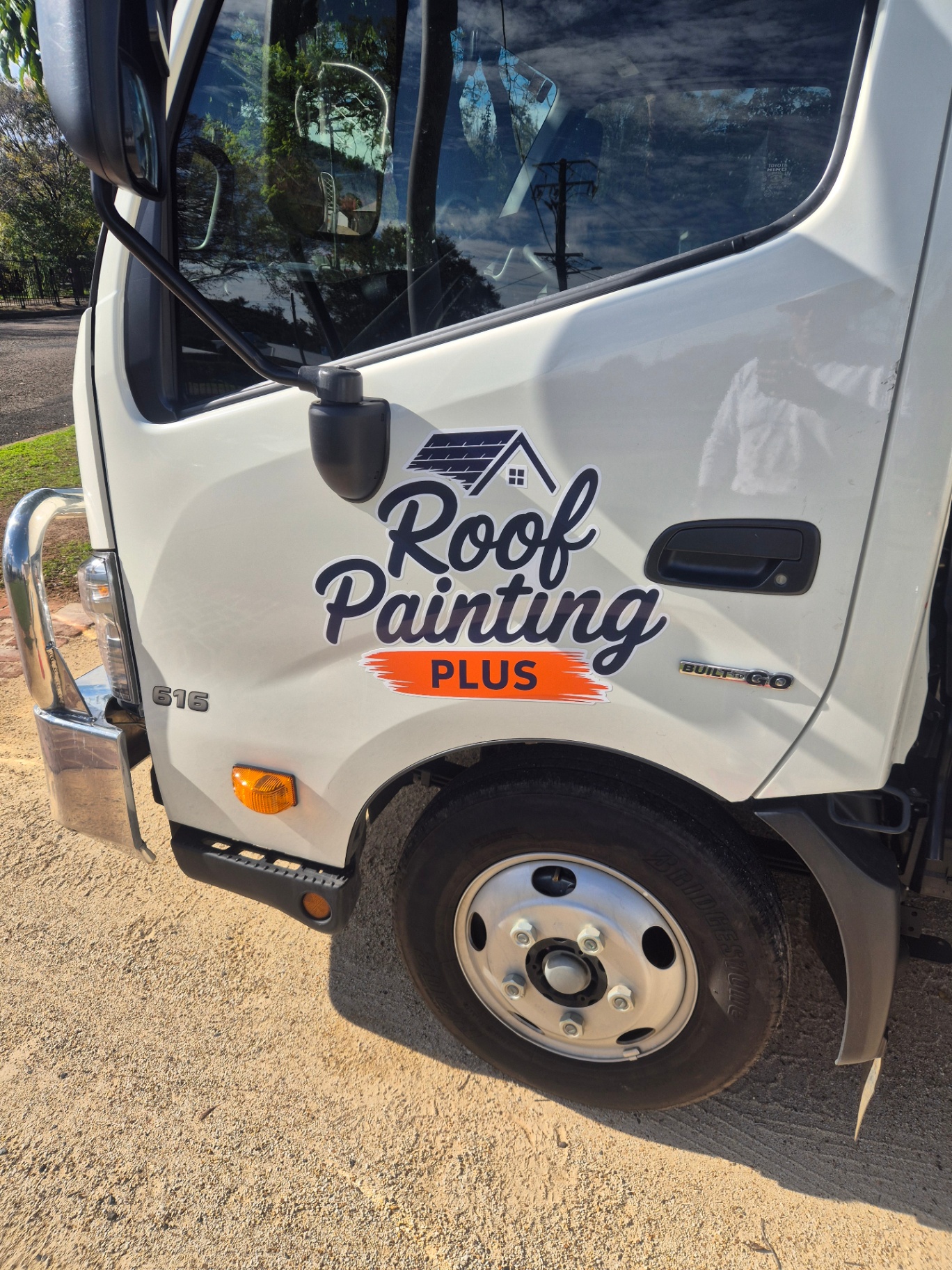 Roof Painting Plus signwritten work truck in Tamworth