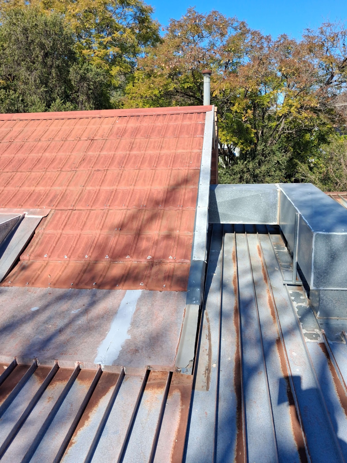 Tin Tile Roof Section and New Flashing Prepared for Repainting in Tamworth