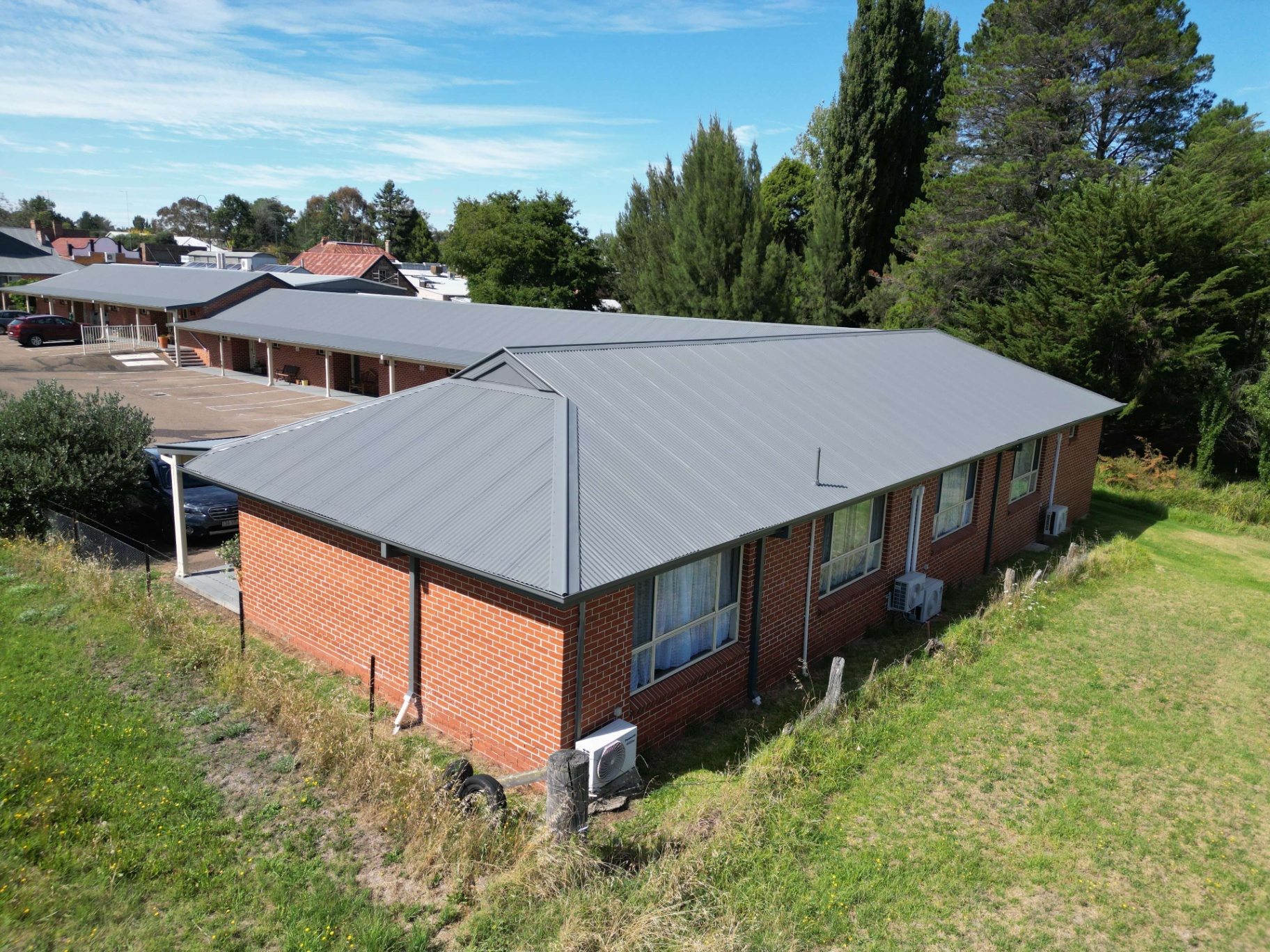 Aerial of a Motel Complex With Corrugated Colorbond Roofing Repainted in Basalt