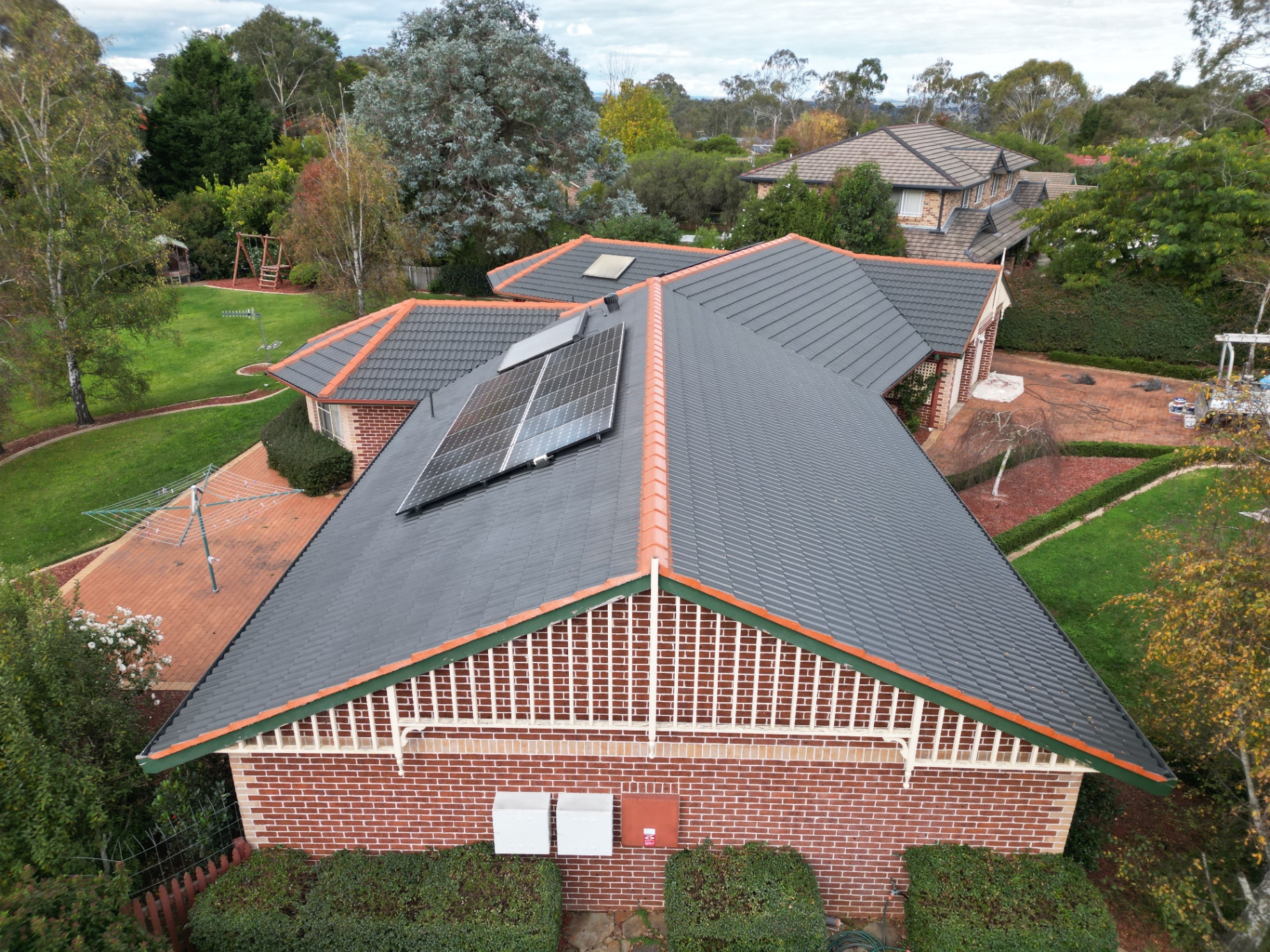 Restored Charcoal Tile Roof and Gable on a Brick Home in Armidale