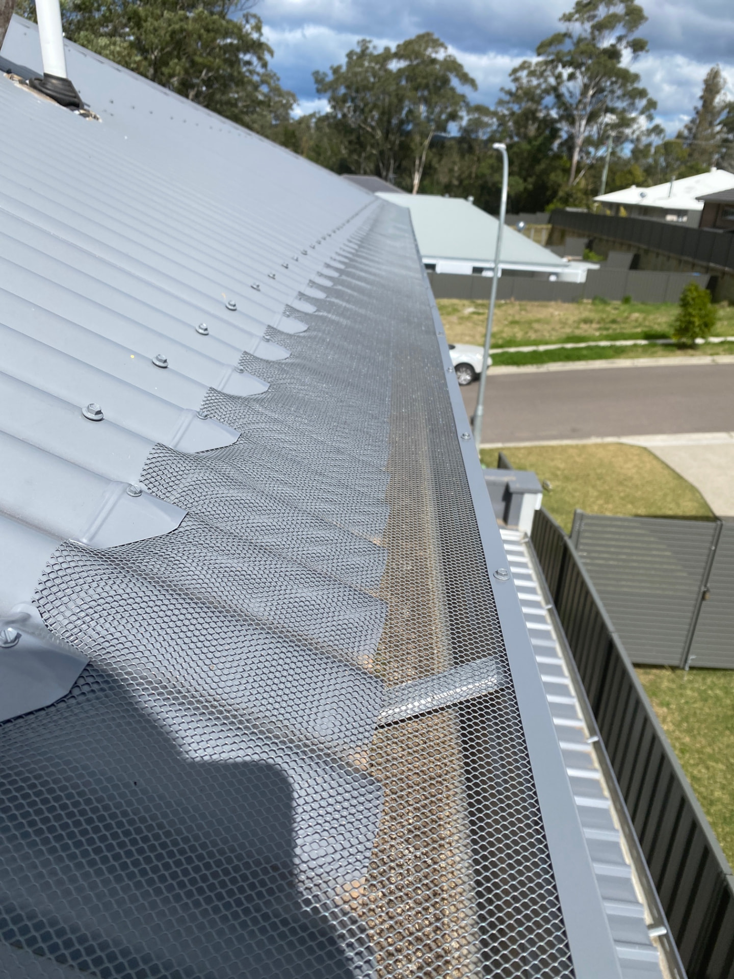 Aluminium Leaf Mesh Gutter Guard Installed on a Metal Roof