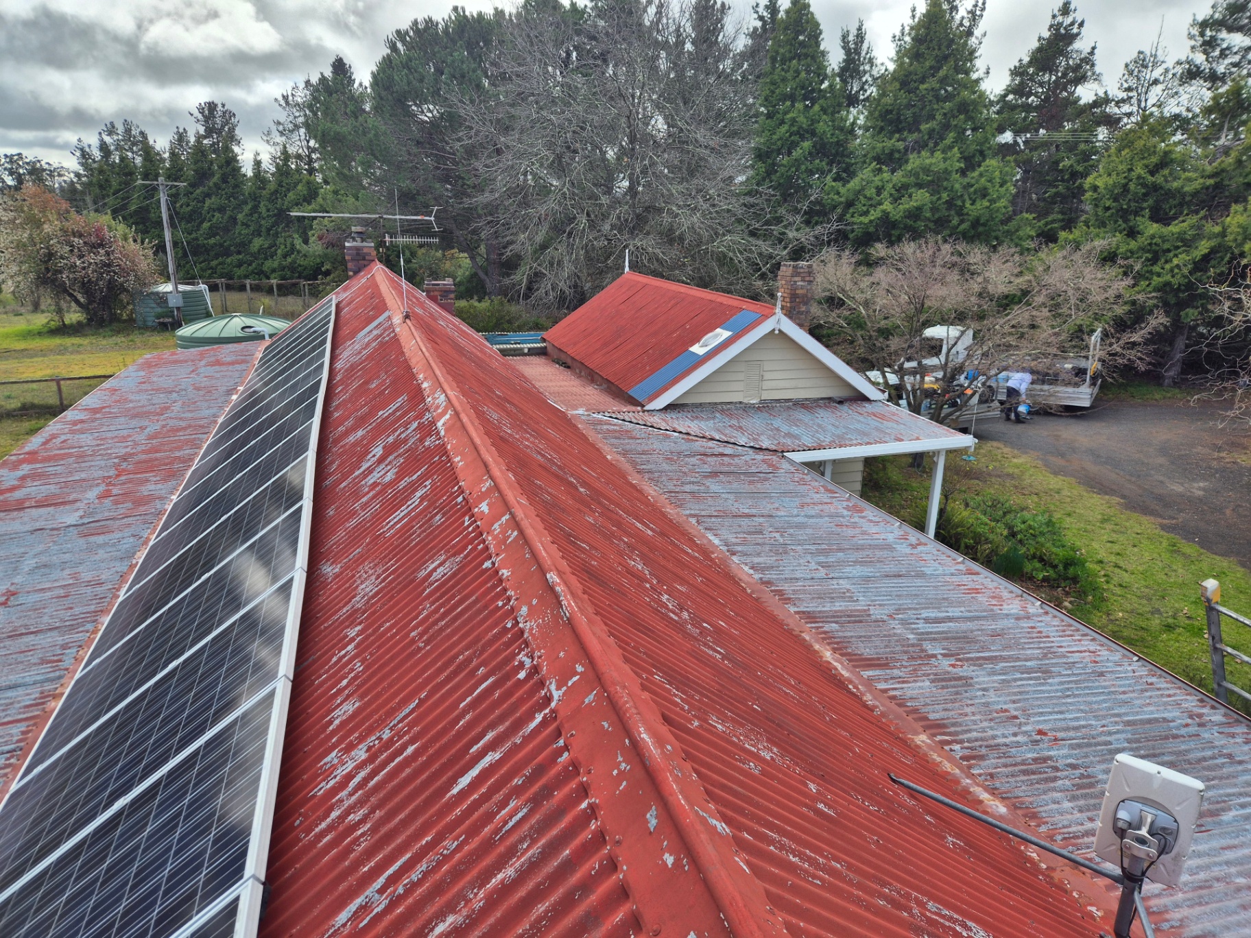 Weathered Red Corrugated Iron Roof With Peeling Paint Before Restoration